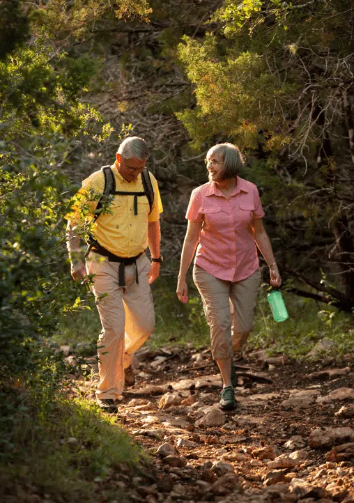 Couple Hiking During The Sunset