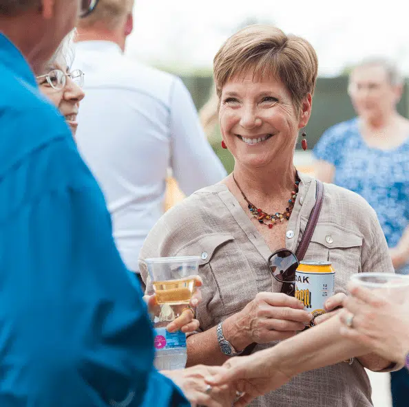 Woman Smiling and Enjoying Talk with KT Residents