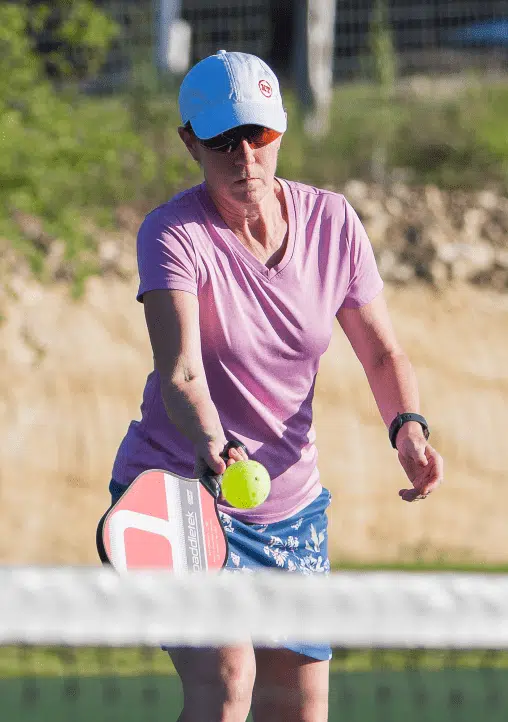 Pickleball Woman Hitting the Ball