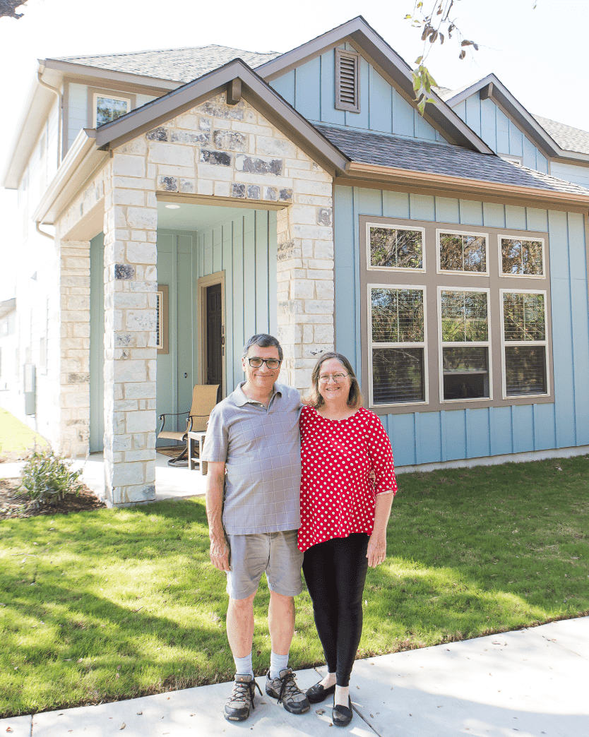 Happy Couple Outside of Their New Home