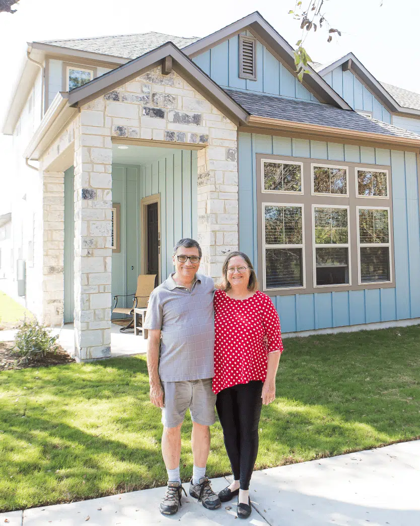 Happy Couple Outside of Their New Home