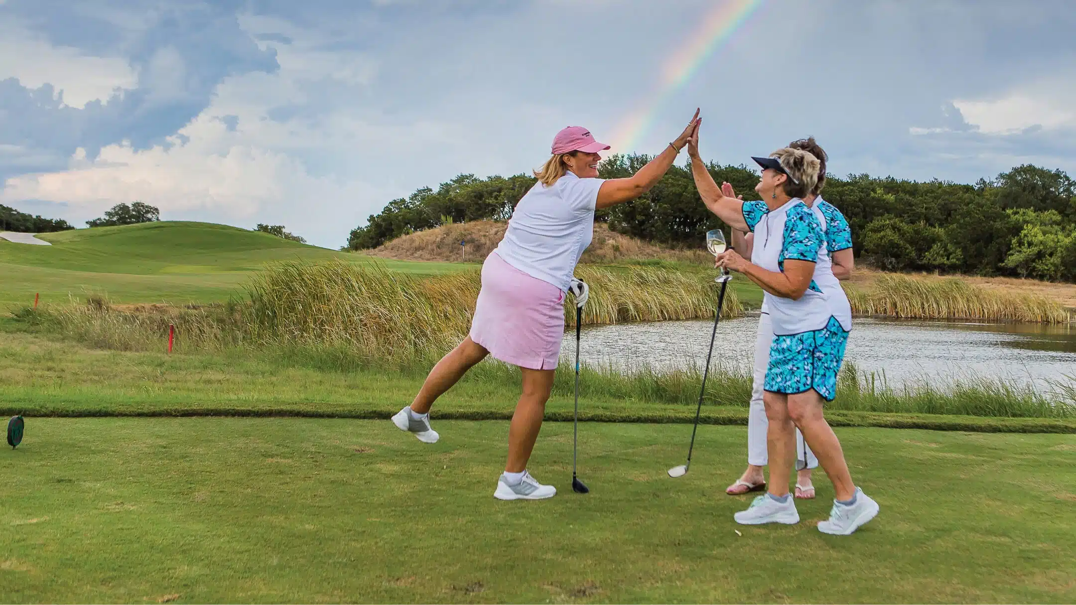 Golfers giving high-fives