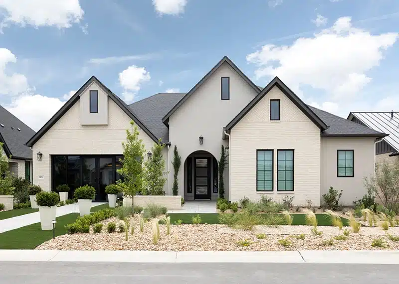 exterior image of model home at kissing tree