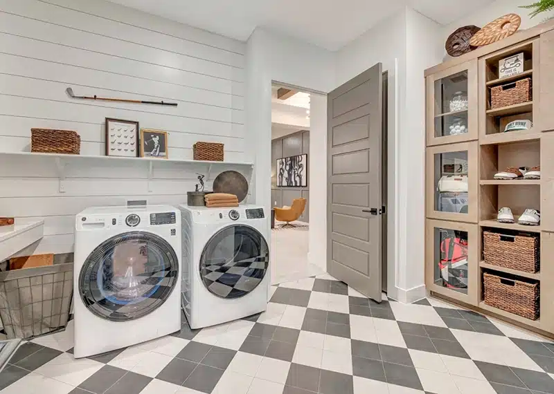 laundry room washer and dryer in model home at kissing tree