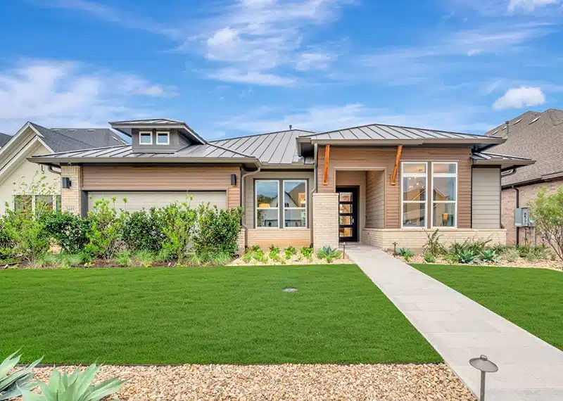 exterior image of model home at kissing tree